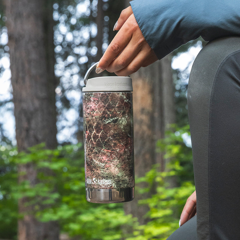 12oz-tkwide-with-twist-cap-mossy-oak-r8 12oz_tumbler_mossyoak_rainbowtrout_hand_closeup_square.jpg